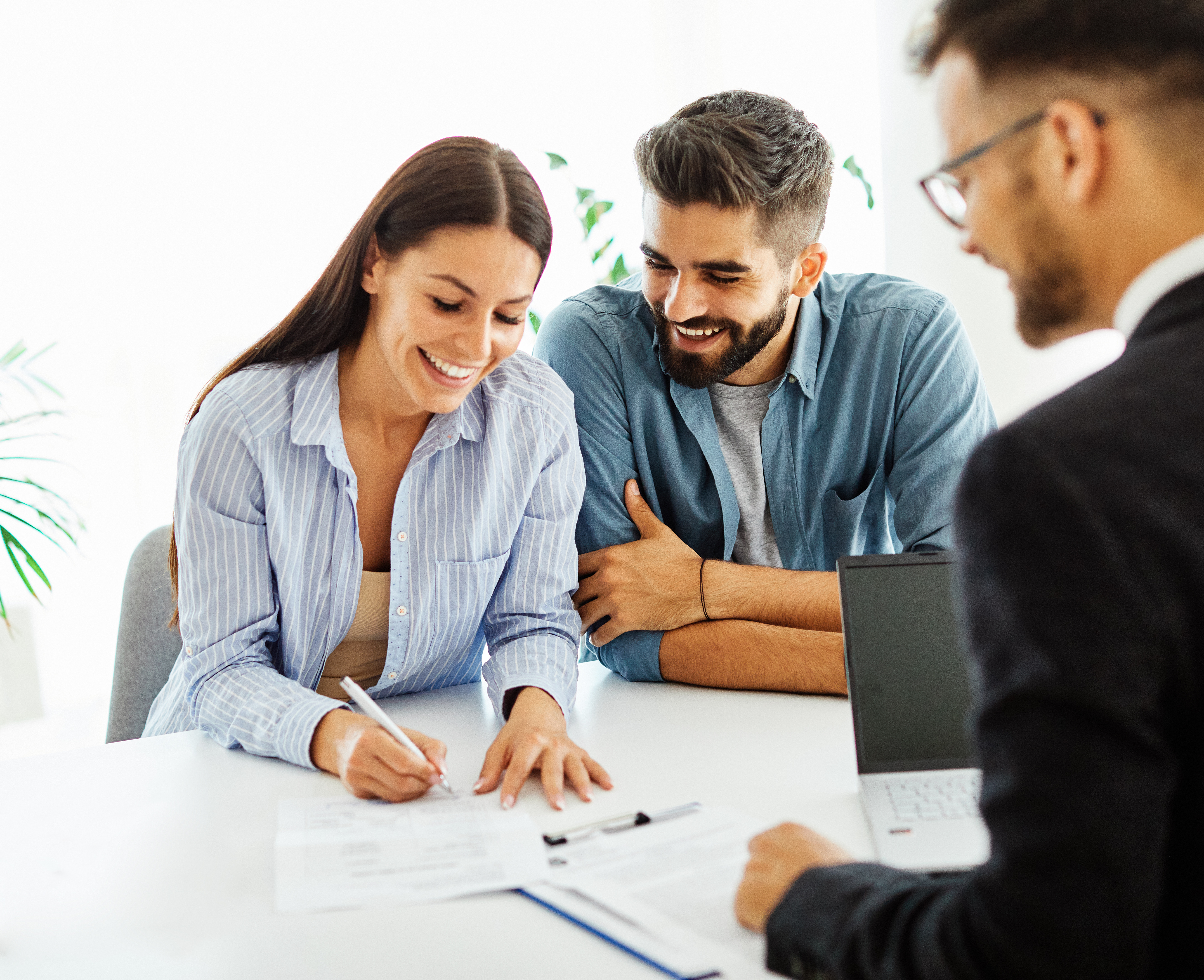 Clients signing loan documents with a notary signing agent